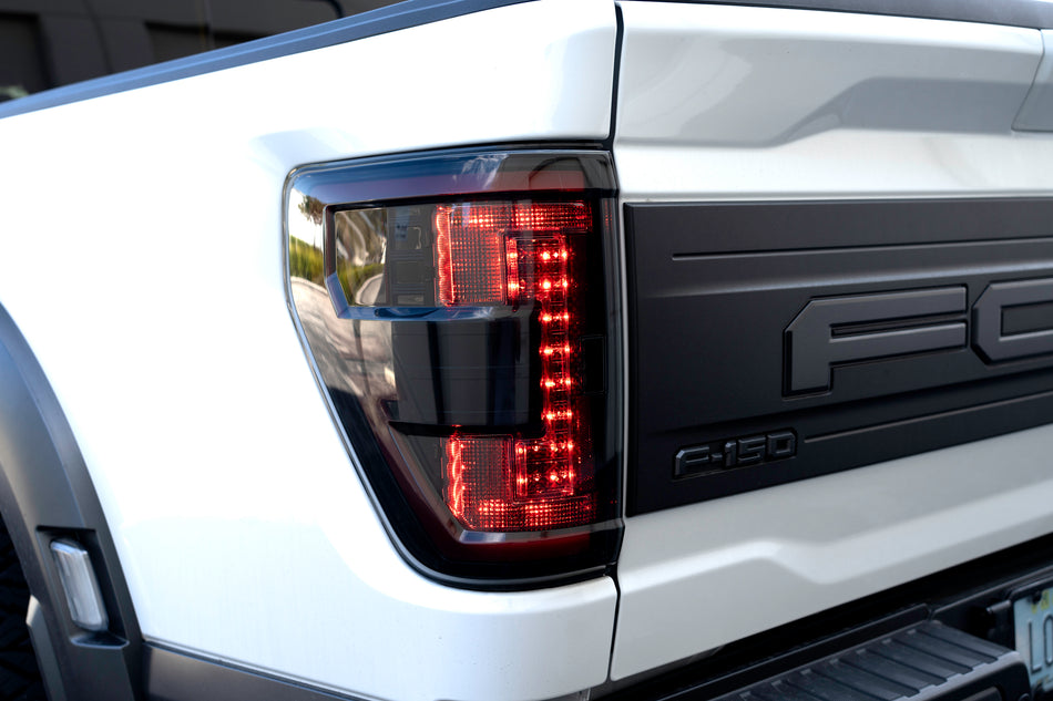 Ford F150 & Ford RAPTOR 21-23 (Attn: This Part ONLY Replaces OEM Factory Installed HALOGEN Style Tail Lights w/ Blind Spot Warning System) Start-Up Light Sequence OLED TAIL LIGHTS - Red Smoked Lens