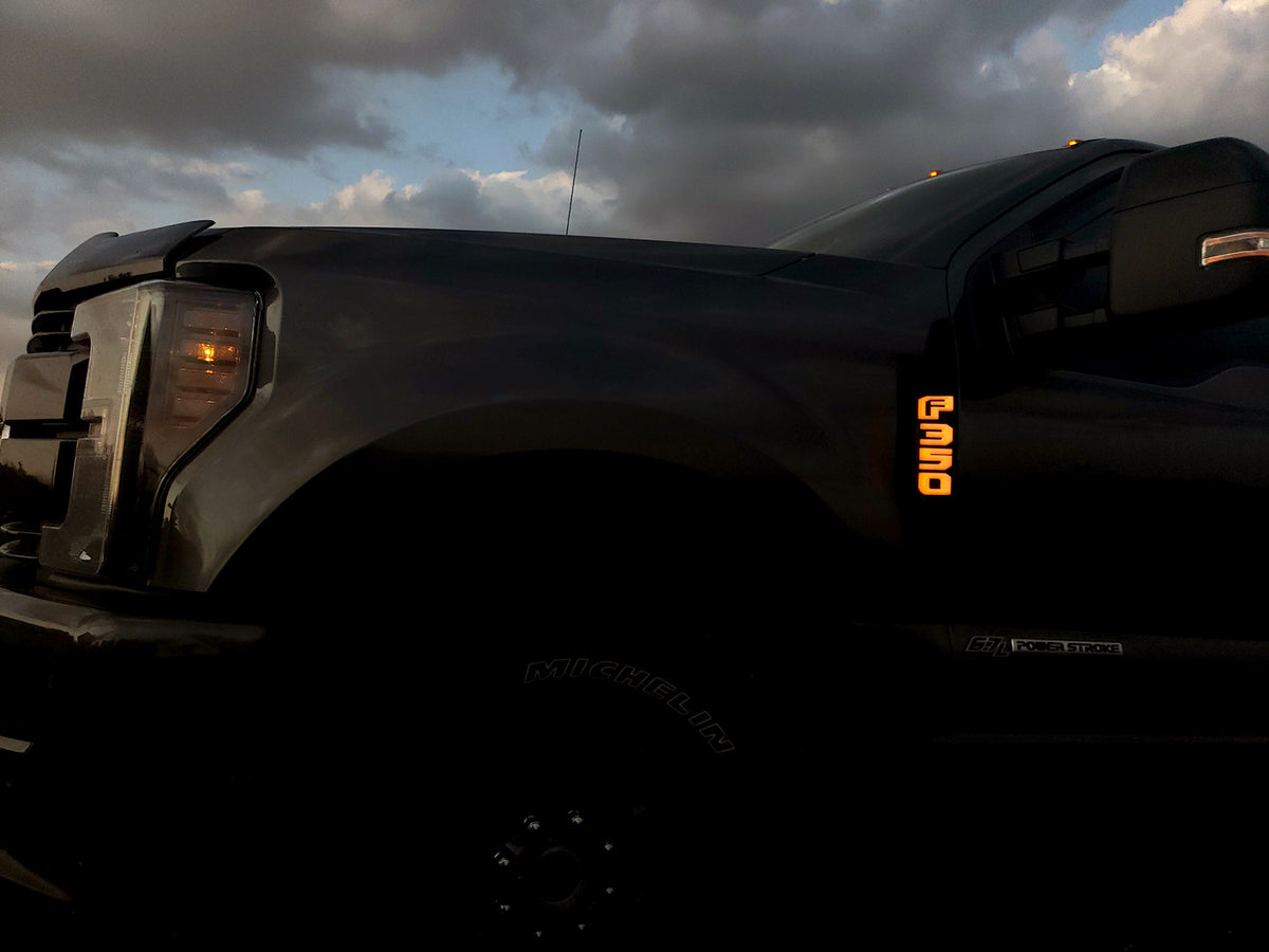 Ford F250 17-19 Illuminated Emblems Black Chrome in amber 2