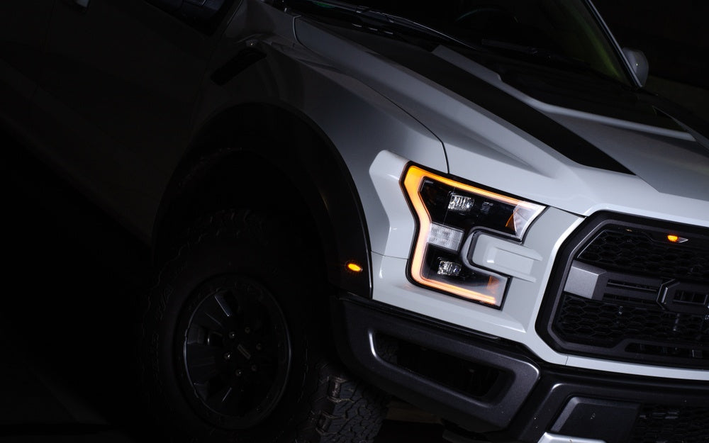 A picture of one of the blacked out headlights on a new Ford F150.